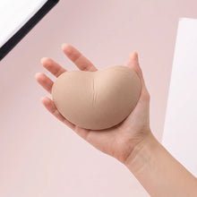 The Sweetheart insert on an open hand to show its true size