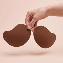 The Invisible Bra in Cocoa held up by its clasp to show the size of the cups