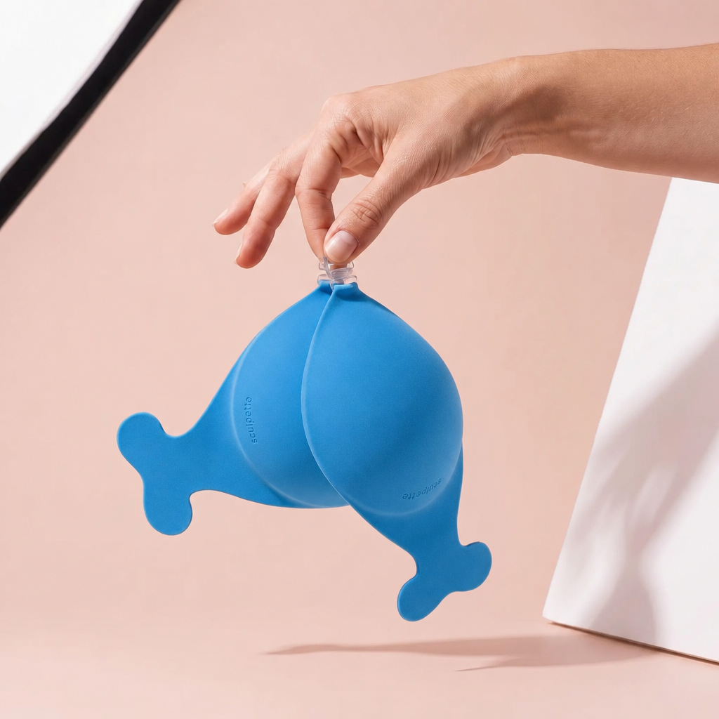 The Statement Bra in Indigo held up by its clasp to show the size of the cups