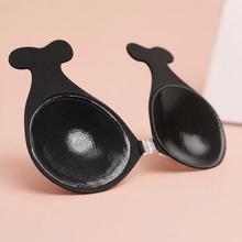 Inside of The Statement Bra cup in Onyx showing the adhesive face and the clear front clasp