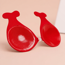 Inside of The Statement Bra cup in Scarlet showing the adhesive face and the clear front clasp