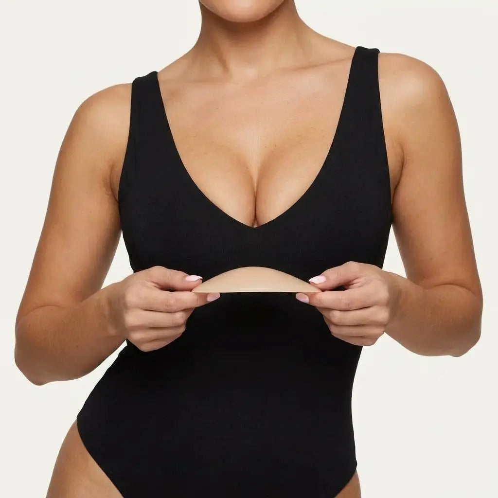 Woman holding The Sculpt Lite insert with both hands